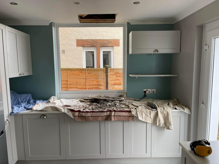 A trace and access plumbing job looking for a leaking pipe in a kitchen